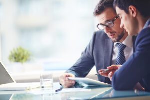 Young,manager,listening,to,his,colleague,explanations