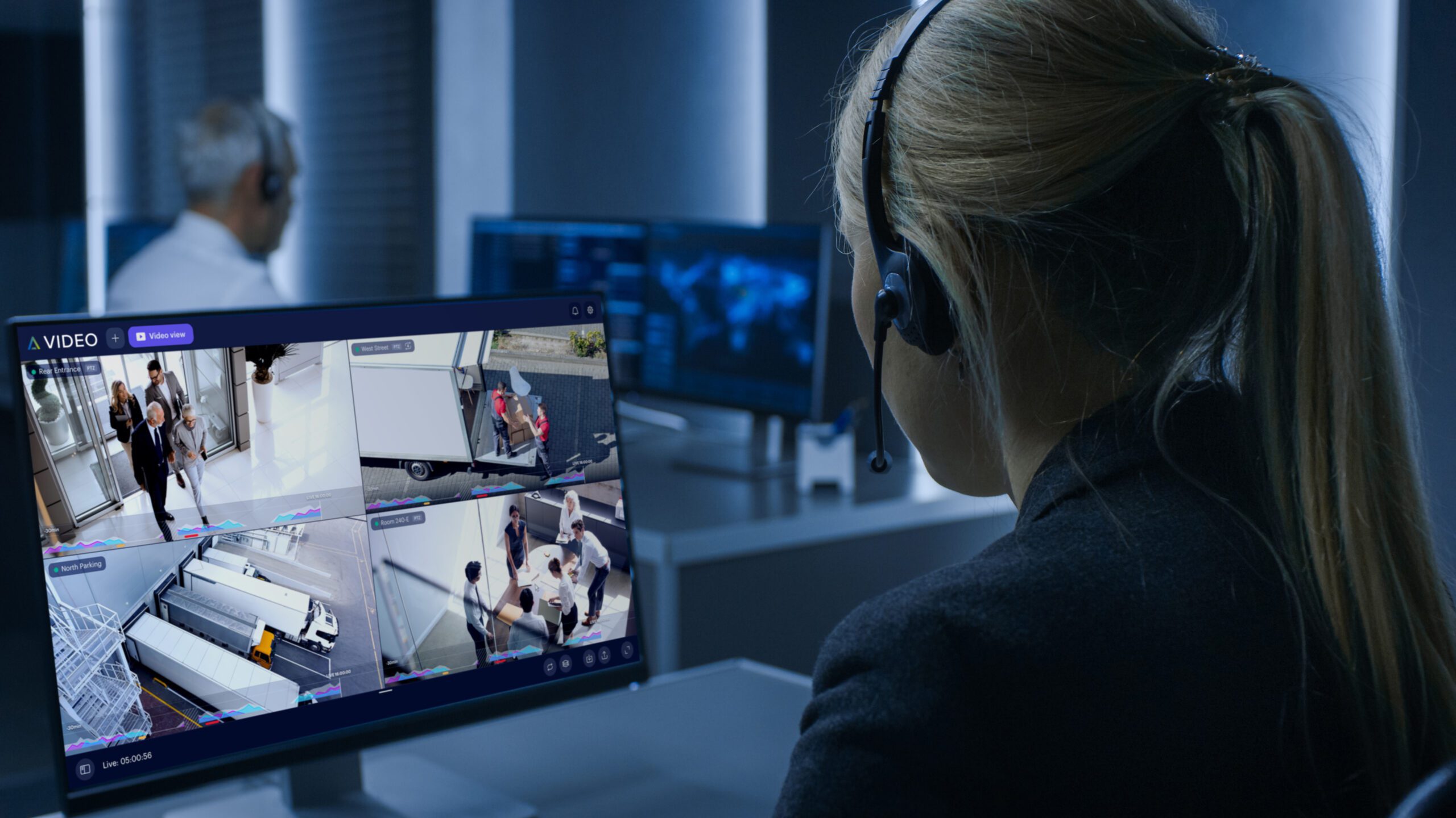 Back,view,of,the,female,controller,wearing,headset,working,on